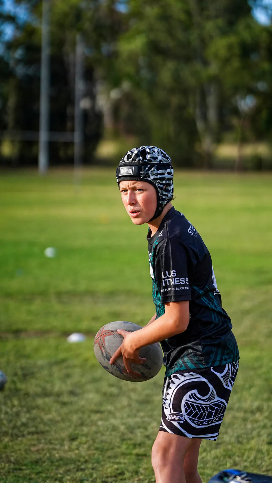Young S2S player in headgear lining up a pass